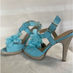 Aqua color heels that have roses which is a nice touch
